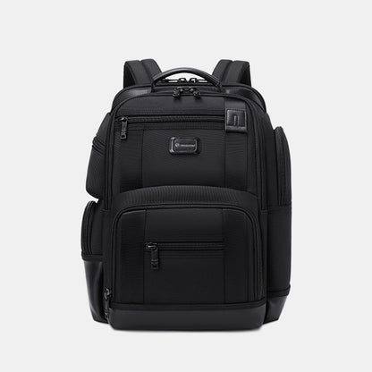 Black backpack on a light gray background