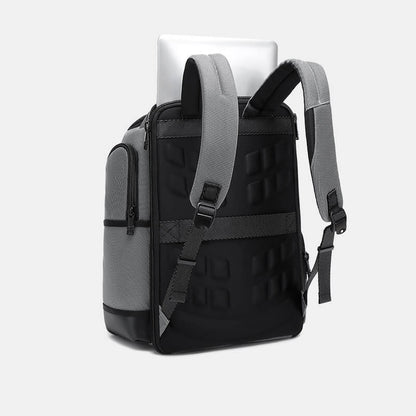 Black and gray backpack with a laptop on a white background