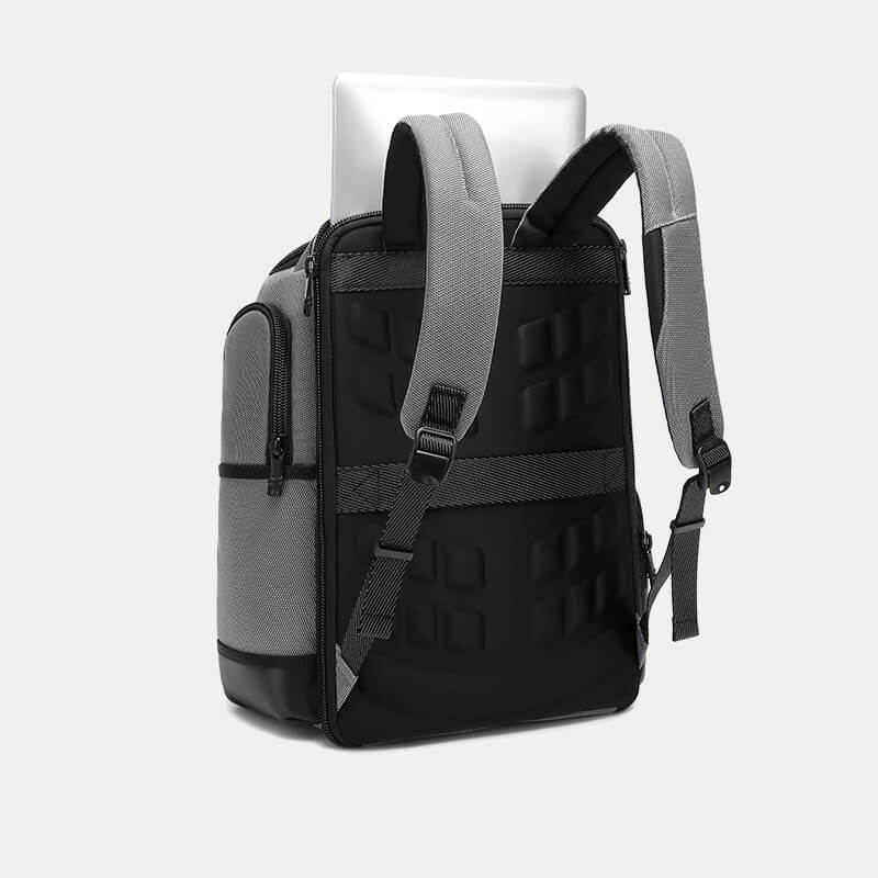 Black and gray backpack with a laptop on a white background