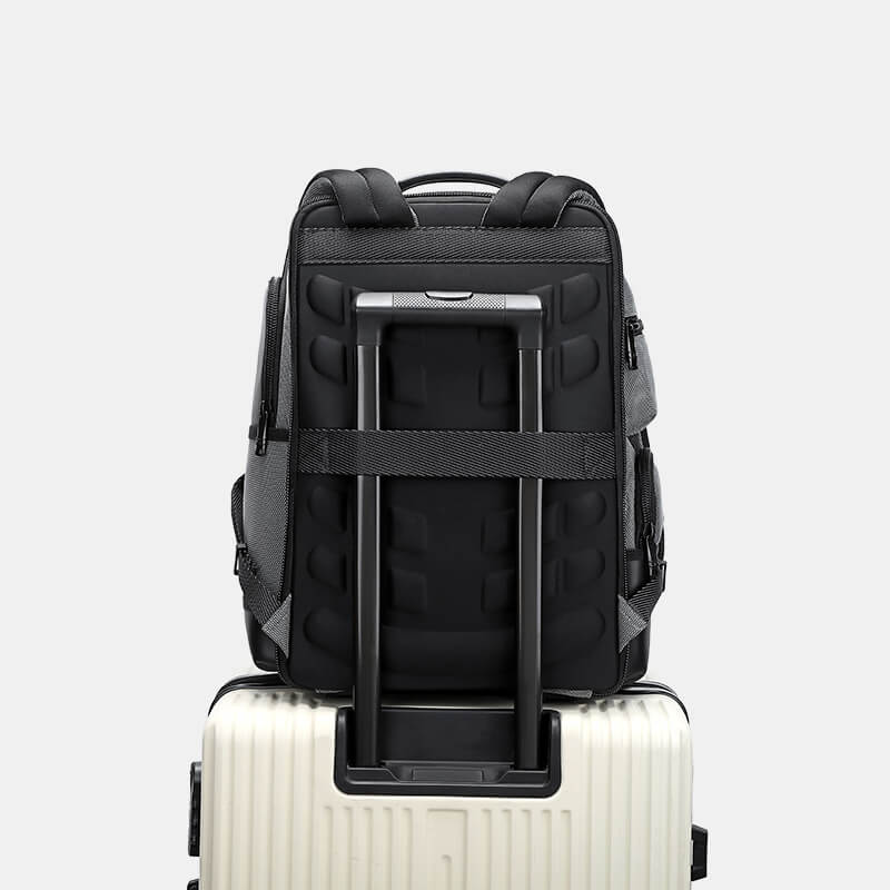 Black backpack with a built-in suitcase on a light gray background